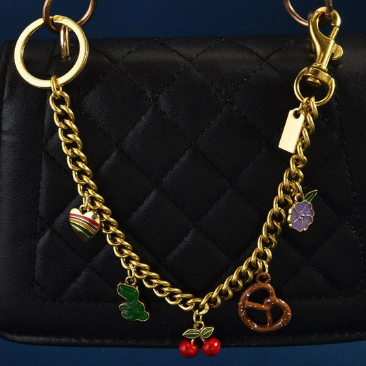 Remington Pretzel & Dinosaur Gold Chain Bag Charm
